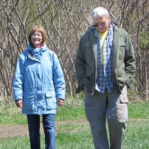 Mike and Rhonda Yoder walking on their farm.